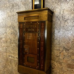 Vintage historic antique mail box with tube delivery system inside
