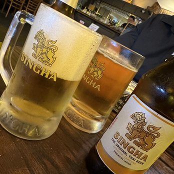 Melanee Thai - a glass of beer and a bottle of beer - Thai Near Me - Los Angeles, California Melanee Thai - a glass of beer and a bottle of beer - Thai Near Me - Los Angeles, California
