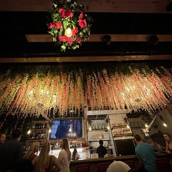 Cafe Vincenzo's - a restaurant with flowers hanging from the ceiling - Pizza Near Me - Myrtle Beach, South Carolina