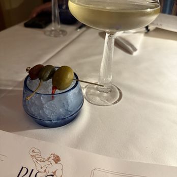 Pisces - SPIRIT OF THE SEA  HOT & DIRTY MARTINI Kástra Elión Vodka, spiced Mediterranean olive brine, olive medley - Mediterranean Near Me - Las Vegas, Nevada
