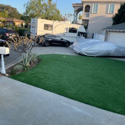 artificial grass in front of a house