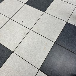Disgusting used q tip and dirty floor Disgusting used q tip and dirty floor