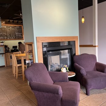 Black Canyon Coffee - two purple chairs in front of a fireplace - Cafes Near Me - Wales, Wisconsin Black Canyon Coffee - two purple chairs in front of a fireplace - Cafes Near Me - Wales, Wisconsin