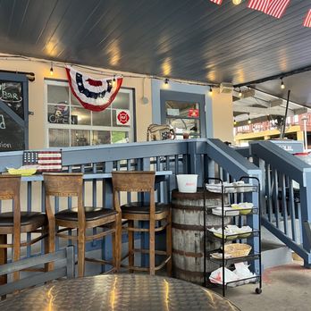 Lake Dora Courtyard - a bar with american flags hanging from the ceiling - Venues & Event Spaces Near Me - Tavares, Florida Lake Dora Courtyard - a bar with american flags hanging from the ceiling - Venues & Event Spaces Near Me - Tavares, Florida