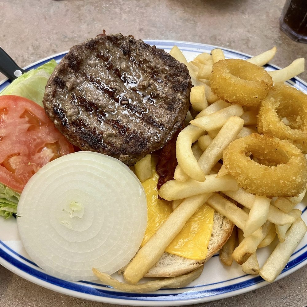 Bacon Cheeseburger, fries and onion rings. Bacon Cheeseburger, fries and onion rings.