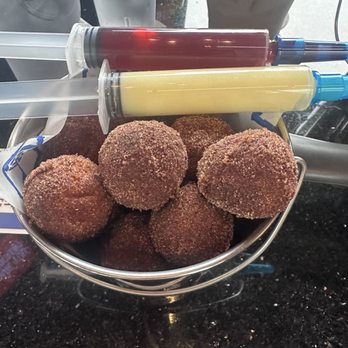 Topgolf - Donut poppers with injectables. - Sports Bars Near Me - Renton, Washington