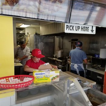 Little Mexico - a man preparing food in a restaurant kitchen - Mexican Near Me - Montebello, California Little Mexico - a man preparing food in a restaurant kitchen - Mexican Near Me - Montebello, California