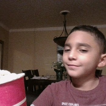 Pops Cones - a boy holding a cup of ice cream - Ice Cream & Frozen Yogurt Near Me - Berlin, New Jersey