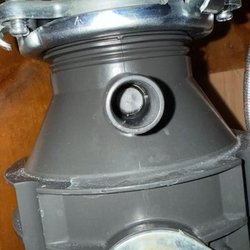 Strawberry Appliance Repair - Disposal with knockout plug still installed, the tech knew about but did not remove.