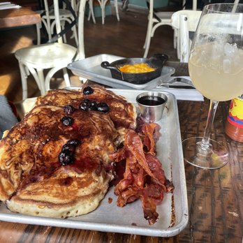 The Second Line - Pancakes, bacon, cheese grits and grapefruit mimosa - Cajun/Creole Near Me - Memphis, Tennessee
