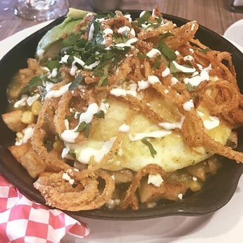 Hash Kitchen - This is the Carnitas skillet. Yep that's right french fried onion rings on the top, so good! - Breakfast & Brunch Near Me - Scottsdale, Arizona