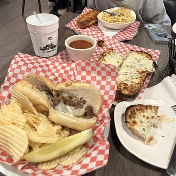 The Mad Italian - 8 inc Philly cheesesteak with chips, chicken Alfredo, mozzarella bread - Italian Near Me - Chamblee, Georgia