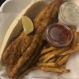 Walleye Sandwich and seasoned fries Walleye Sandwich and seasoned fries