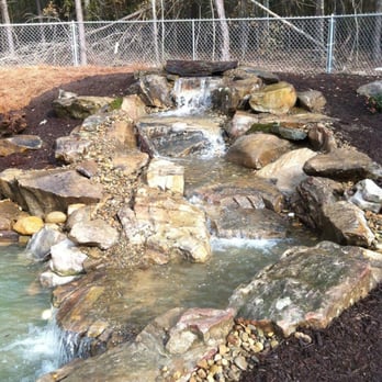Silver Palm Landscaping - a waterfall in a garden - Landscaping Near Me - Aiken, South Carolina Silver Palm Landscaping - a waterfall in a garden - Landscaping Near Me - Aiken, South Carolina