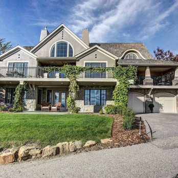 Gambrick Construction - Exterior view of new country home in Colts Neck NJ. Stucco finish with cultured stone veneer. - General Contractors Near Me - Point Pleasant, New Jersey