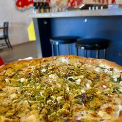 Il Focolare - Shaved Brussel Sprouts & Chèvre Pizza with white sauce and a hint of heat. Delicious!