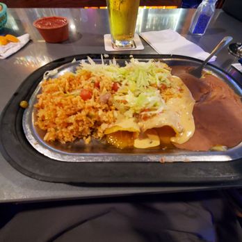 Ponak's Mexican Kitchen - Two enchiladas,rice and refried beans. They give you so much it's hard to finish. Yummy - Mexican Near Me - Kansas City, Missouri Ponak's Mexican Kitchen - Two enchiladas,rice and refried beans. They give you so much it's hard to finish. Yummy - Mexican Near Me - Kansas City, Missouri
