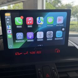 Mobile Install Solutions - CARPURIDE W905 Wireless CarPlay & Android Auto system, along with a backup camera.
