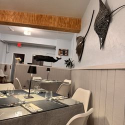 Coast Seafood Restaurant - Interior looking to the back, beautiful stingrays on the wall. They were on point with the coastal vibe.