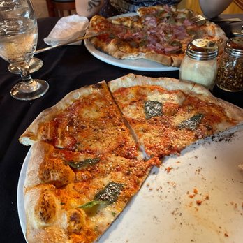 Pizza Pazzo - a half eaten pizza on a plate - Pizza Near Me - Mount Pleasant, South Carolina