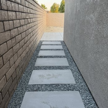 Desert Pros Landscape - Side alley after pour, gravel, and still drying. - Landscaping Near Me