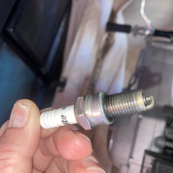 Harley's Custom Cycle Works - Another picture of spark plug, showing the age, and the length of wrong spark plug - Motorcycle Repair Near Me - Lake Elsinore, California