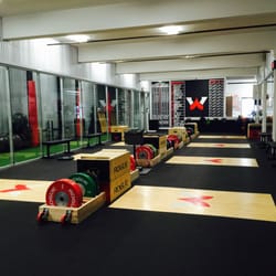 Athletes Warehouse - 8 Olympic lifting platforms and 14 squat racks
