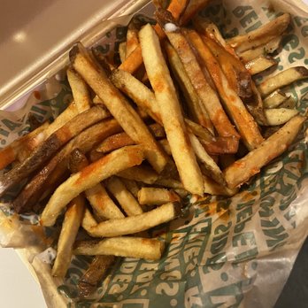 Wingstop - a tray of french fries with ketchup - Chicken Wings Near Me - La Puente, California