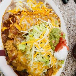 El Mexicano II - 3 item specialty plate. Shredded beef burrito, chile Reyano, a taco under the mound of lettuce, sour cream and guacamole . Delicious
