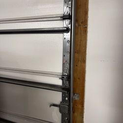Apple Garage Door - Tom fixed the existing door when he noticed the prior owners had hit it...replaced the hinges!