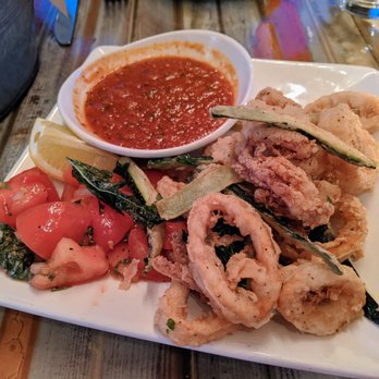 Mirko Pasta - Fried Calamari and Zucchini. Fried squid and zucchini with lemon, marinated fresh tomatoes, and spicy tomato sauce. $14. - Italian Near Me - Atlanta, Georgia Mirko Pasta - Fried Calamari and Zucchini. Fried squid and zucchini with lemon, marinated fresh tomatoes, and spicy tomato sauce. $14. - Italian Near Me - Atlanta, Georgia
