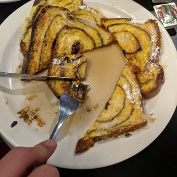 Wooded Island - a plate of french toast with a knife and fork - American Near Me - Caseville, Michigan Wooded Island - a plate of french toast with a knife and fork - American Near Me - Caseville, Michigan
