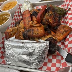 El Guero Pollo Asados - Whole chicken, Mexican sausage, onion (in foil), tortillas, rice, beans, avacado and grilled jalapeno.
