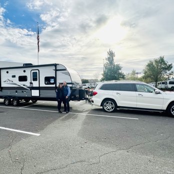 Camping World - Wood Village - My husband and I with our new family travel trailer hitched and ready to go! Jayco Jay Flight 267BHSW 2024. - RV Dealers Near Me - Wood Village, Oregon Camping World - Wood Village - My husband and I with our new family travel trailer hitched and ready to go! Jayco Jay Flight 267BHSW 2024. - RV Dealers Near Me - Wood Village, Oregon