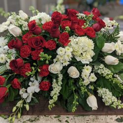 Seatac Buds & Blooms - Casket. Roses, Snap dragons, Larkspur, Hydrangea, Carnations