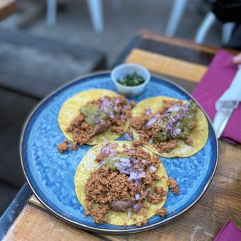Fonda Lola - three tacos on a blue plate - Mexican Near Me - Toronto, Ontario Fonda Lola - three tacos on a blue plate - Mexican Near Me - Toronto, Ontario