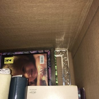 SERVPRO Lower Shore, Mid-Upper Shore, Talbot/Dorchester - Different box showing fragile picture frames not wrapped and packed under heavy books. - Damage Restoration Near Me - Hebron, Maryland SERVPRO Lower Shore, Mid-Upper Shore, Talbot/Dorchester - Different box showing fragile picture frames not wrapped and packed under heavy books. - Damage Restoration Near Me - Hebron, Maryland