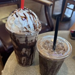 The Grind - The 24 oz Road Warrior on the left and a 16 oz Salted Caramel on the right.