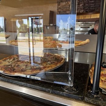 Bella Roma - Cases showcasing their pizza - Pizza Near Me - Port St. Lucie, Florida