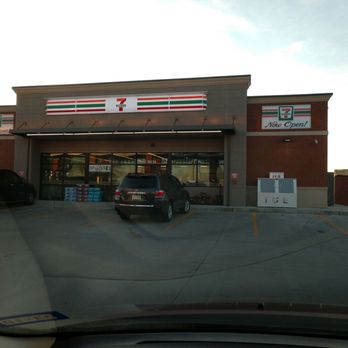 7-Eleven - a car parked in front of a store - Convenience Stores Near Me - Irving, Texas