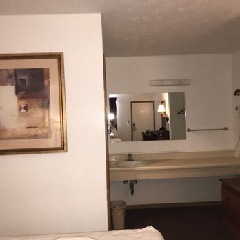 Yorkshire Inn & Suites - Large bathroom sink and counter with hangers available and luggage rack. - Hotels Near Me - York, Nebraska Yorkshire Inn & Suites - Large bathroom sink and counter with hangers available and luggage rack. - Hotels Near Me - York, Nebraska