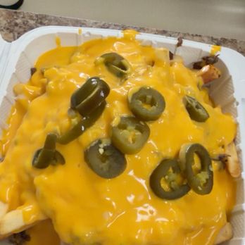 Tacos Charly - Asada fries ..under cheese is meat beans sour cream salsa pico de gallo - Mexican Near Me - Pacoima, California Tacos Charly - Asada fries ..under cheese is meat beans sour cream salsa pico de gallo - Mexican Near Me - Pacoima, California