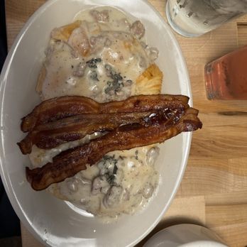 Blue Dahlia Bistro - with gravy & crispy bacon - Modern European Near Me - San Marcos, Texas