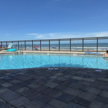 Tropic Sun Towers - Pool with beach in background. - Hotels Near Me - Ormond Beach, Florida Tropic Sun Towers - Pool with beach in background. - Hotels Near Me - Ormond Beach, Florida