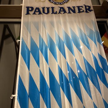 Prost - a blue and white banner hanging in front of a window - German Near Me - Wichita, Kansas