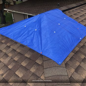 Lion Construction and Roofing - a blue kite on the roof - Roofing Near Me - Katy, Texas Lion Construction and Roofing - a blue kite on the roof - Roofing Near Me - Katy, Texas