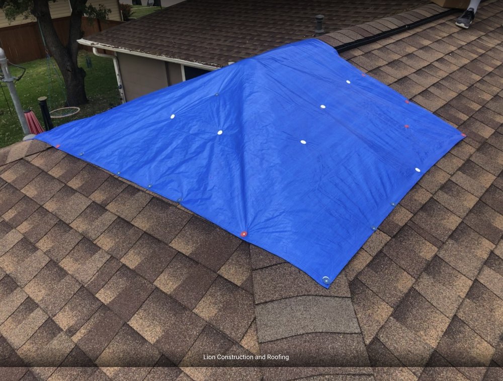 Slide of Lion Construction and Roofing