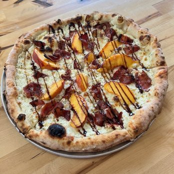 Toss Wood Fired Eatery - Palisade peaches, ricotta cheese and applewood smoked bacon. - Pizza Near Me - Rollinsville, Colorado Toss Wood Fired Eatery - Palisade peaches, ricotta cheese and applewood smoked bacon. - Pizza Near Me - Rollinsville, Colorado