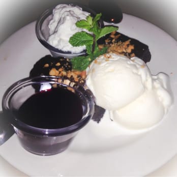 Bonefish Grill - The evil Macadamia Nut Brownie, a flourless brownie, served with raspberry sauce and vanilla ice cream - Seafood Near Me - Brandon, Florida