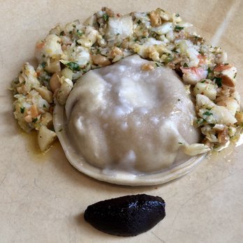 Besa - Ramen ravioli. Didn't appreciate the ramen touch but it was good. The black thing is a garlic purée that looks like a clove. Clever. - New American Near Me - Detroit, Michigan